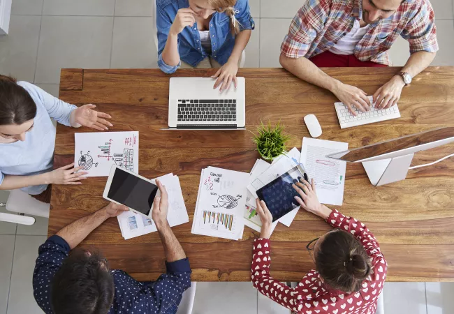 top-view-coworkers-team-working-office.jpg