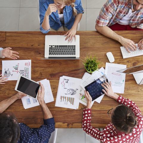 top-view-coworkers-team-working-office.jpg